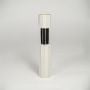 White and black metal decorative candle holder with sleek cylindrical design isolated on white background for contemporary decor display.