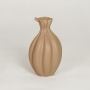 Beige ceramic sculpted decorative vase with organic petal design ideal for dried flower arrangement and contemporary home decor styling.