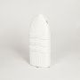 White ceramic sculpted decorative vase with vertical ribbed detailing isolated on white background for modern interior decor placement.