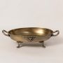 Antique style brass decorative bowl with ornate handles and carved legs perfect for table decor and luxury home styling.