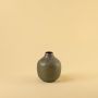Brown hammered metal vase decor on clean white background ideal for modern shelves consoles and tabletop styling.