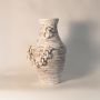 Rustic tall chain vase displayed on white background highlighting handcrafted ceramic texture and sculptural chain detail.