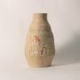 Hieroglyph vase displayed on white background showing engraved Egyptian-inspired motifs and smooth handcrafted texture.