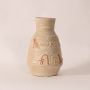 Small hieroglyph vase on white background highlighting intricate carved patterns and smooth handcrafted ceramic finish.