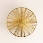 Metallic golden wire art wall decor with circular design displayed on white background for stylish interiors.