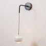 Minimalist Round Ball Metal Wall Light White Light On White Background