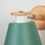 Modern wooden wall sconce with green lampshade light off white background for bedroom study room and hallway stylish decorative wall lighting.