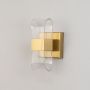 Gold wall light with ribbed clear glass shade shown on a bright white background for accurate detailed clarity.
