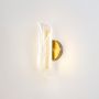 curl design acrylic led wall light gold light on white background