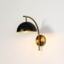 marcel wall sconce black light on white background