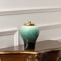 Elegant ceramic decorative jar in green and black shades with gold lid designed for console table shelf and sideboard decor.