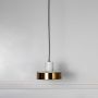 Pendant light with white marble top and golden base shade displayed off on white background for stylish home interiors.